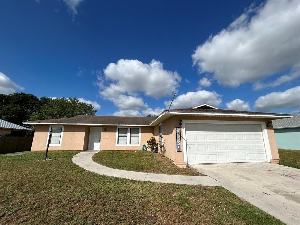 Photo of 418 SW Friar Street, Port St Lucie, FL 34983 (MLS # R10872308)
