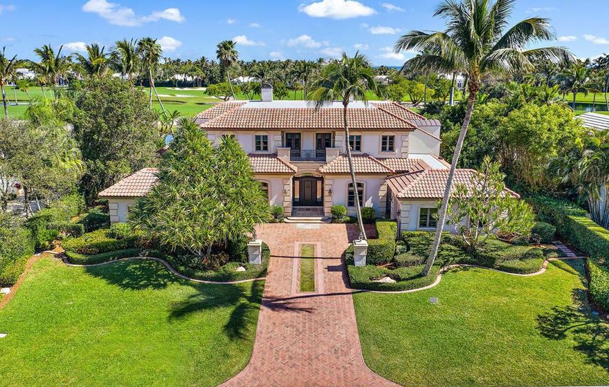 Enjoy spectacular golf course and sparkling water views from this custom, two-story, Mizner inspired, home overlooking the 13th fairway at Lost Tree Club.  Move in ready, this gracious home with generously proportioned rooms and great flow for effortless entertaining, features a stunning living room with cast stone fireplace, a handsome chestnut paneled study, and a lovely master suite on the ground level.  The second floor offers two private wings with dedicated staircases, each with two bedrooms and ensuite baths, ideal for family and friends. This solidly built home is of the highest quality with 10'-12' ceilings throughout and bespoke details including coffered ceilings, curved plaster walls, arched doorways, rich stone and hardwood floors, and custom moldings throughout. Completing the home are a whole house generator, lighting system, irrigation, landscape lighting, lovely fountain, and pool.  One of the most renowned golf club communities in the country, Lost Tree Village and the Lost Tree club offer luxury, security, privacy, and amenities including, golf, private beach, pools, tennis, fitness center, spa, and oceanfront dining.