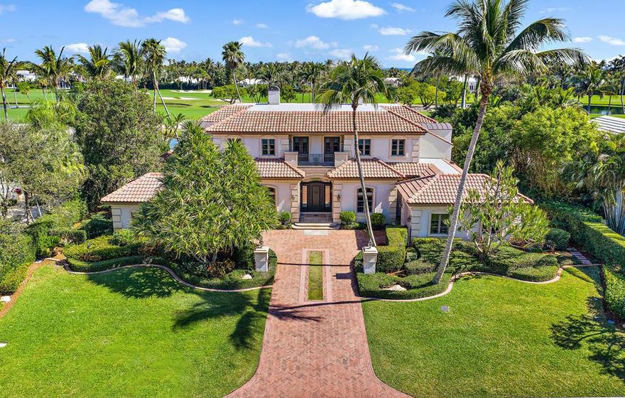 Enjoy spectacular golf course and sparkling water views from this custom, two-story, Mizner inspired, home overlooking the 13th fairway at Lost Tree Club.  Move in ready, this gracious home with generously proportioned rooms and great flow for effortless entertaining, features a stunning living room with cast stone fireplace, a handsome chestnut paneled study, and a lovely master suite on the ground level.  The second floor offers two private wings with dedicated staircases, each with two bedrooms and ensuite baths, ideal for family and friends. This solidly built home is of the highest quality with 10'-12' ceilings throughout and bespoke details including coffered ceilings, curved plaster walls, arched doorways, rich stone and hardwood floors, and custom moldings throughout. Completing the home are a whole house generator, lighting system, irrigation, landscape lighting, lovely fountain, and pool.  One of the most renowned golf club communities in the country, Lost Tree Village and the Lost Tree club offer luxury, security, privacy, and amenities including, golf, private beach, pools, tennis, fitness center, spa, and oceanfront dining.