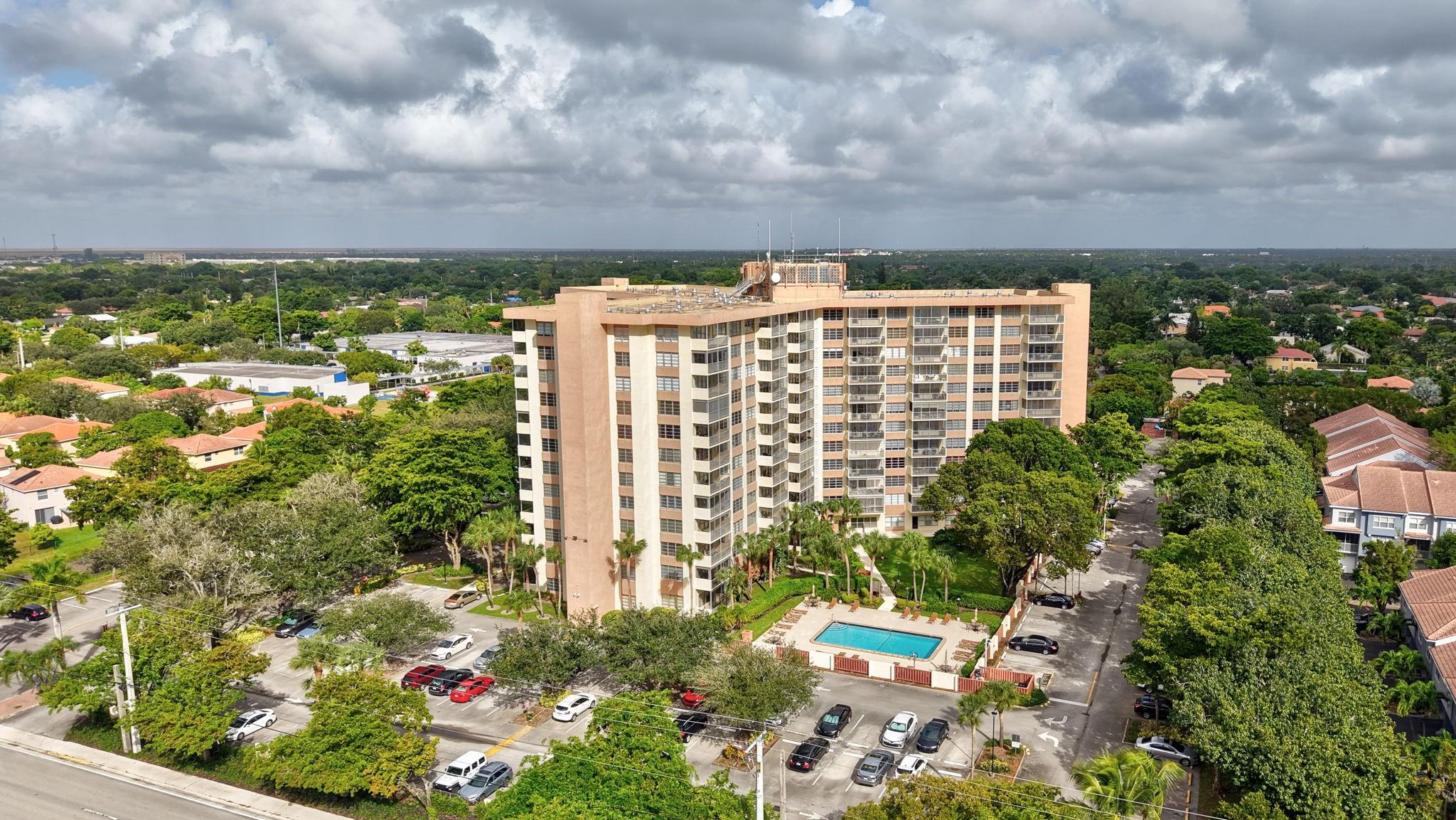 Great views. Great Location. Great Security. Up to date inspections. This versitile 2 bedroom, 2-bath corner unit, featuring spectacular views, includes crown molding in the naturally lit living and dining areas. The balcony overlooking Coral Springs and the swimming pool offers gorgeous sunrises and afternoon relaxation. The spacious master suite includes a large walk-in closet and pleanty of storage, while the 2nd bedroom includes a Murphy Bed, giving the room the versatility to be an office or crafts-room as well. Centrally located in Coral Springs, this 55+ community is close to shopping and dining and provides excellent amenities including 24 hour security, large swimming pool, gym, library, fitness center and laundry facility on every floor. HOA fees cover water, cable and internet.