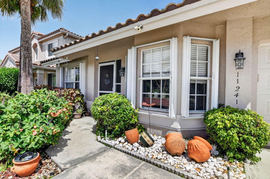 Photo of 11241 Coral Reef Drive, Boca Raton, FL 33498 (MLS # B26066274)