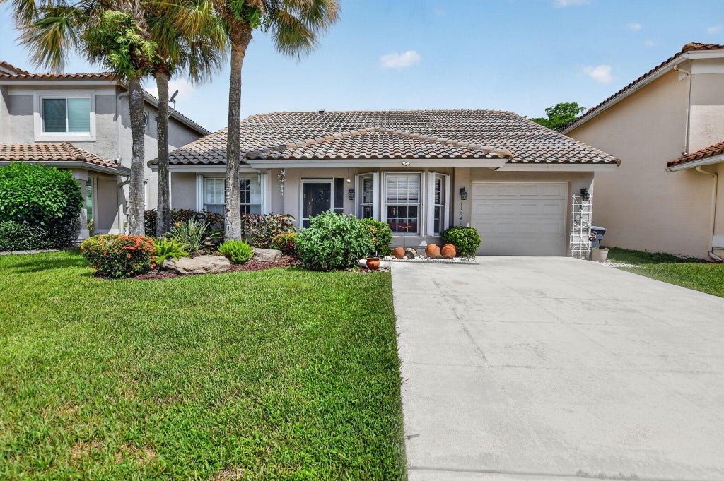 Photo of 11241 Coral Reef Drive, Boca Raton, FL 33498 (MLS # B26066274)