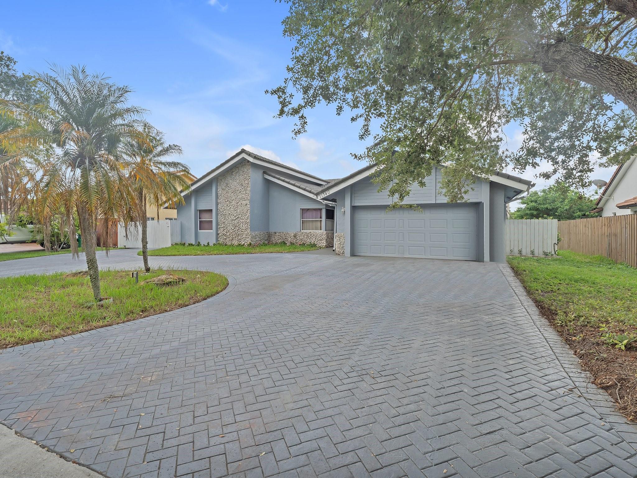 Welcome to this canal-front home offering the perfect blend of comfort and functionality. Featuring a screened-in heated pool, the pool deck is pre-wired for a hot tub, private dock with a fully operational boat lift, and peaceful canal views. Inside, you'll find an updated kitchen and bathrooms with modern finishes and upgraded plumbing. Two fairly new A/C units, and an added loft above the kitchen that can be used for anything you'd like. The oversized driveway extends past the front gate, perfect for storing a boat or trailer. With a 2-car garage, brand new hurricane-rated garage door adds extra security. Pride of ownership shines throughout! This home offers comfort, security, and plenty of outdoor enjoyment—all in a community you’ll love to call home.