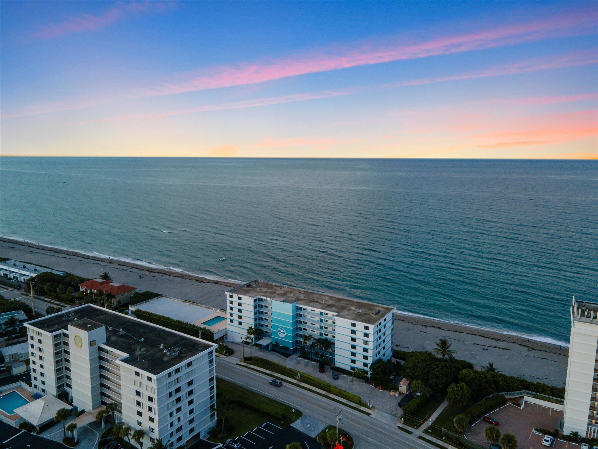 This beautifully renovated oceanfront condo at The Surf offers sweeping, unobstructed views of the Atlantic and an easy, turnkey lifestyle in the heart of Juno Beach. The entire unit has been thoughtfully redesigned with a clean, modern coastal feel. The open kitchen features sleek quartz countertops, European-style cabinetry, and a stylish backsplash that flows into the spacious living and dining areas--framed by floor-to-ceiling impact windows showcasing the ocean. Porcelain tile floors run throughout, and the primary suite offers its own incredible views along with a spa-like bathroom and custom walk-in closet. You'll also find a fully updated guest bath, new lighting and fixtures, impact glass windows and doors, and a full-size washer and dryer inside the unit. SEE MORE..