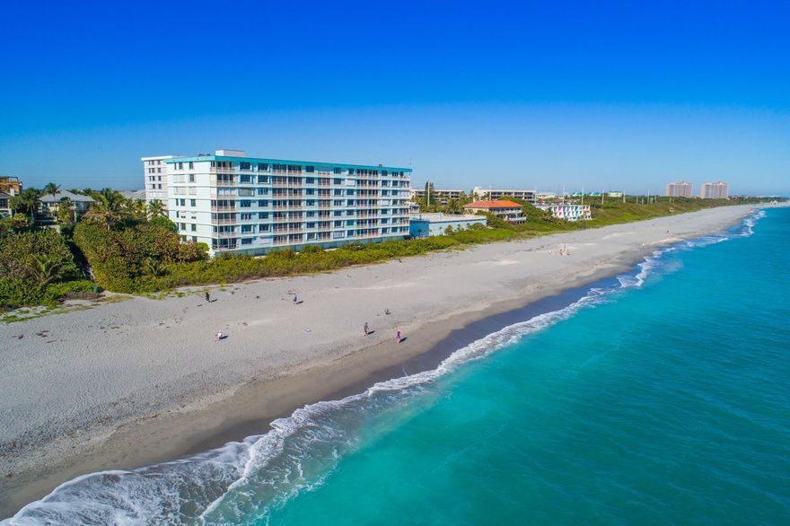 This beautifully renovated oceanfront condo at The Surf offers sweeping, unobstructed views of the Atlantic and an easy, turnkey lifestyle in the heart of Juno Beach. Offered with the option to be fully furnished, this unit has been thoughtfully redesigned with a clean, modern coastal feel. The open kitchen features sleek quartz countertops, European-style cabinetry, and a stylish backsplash that flows into the spacious living and dining areas--framed by floor-to-ceiling impact windows showcasing the ocean. Porcelain tile floors run throughout, and the primary suite offers its own incredible views along with a spa-like bathroom and custom walk-in closet. SEE MORE...