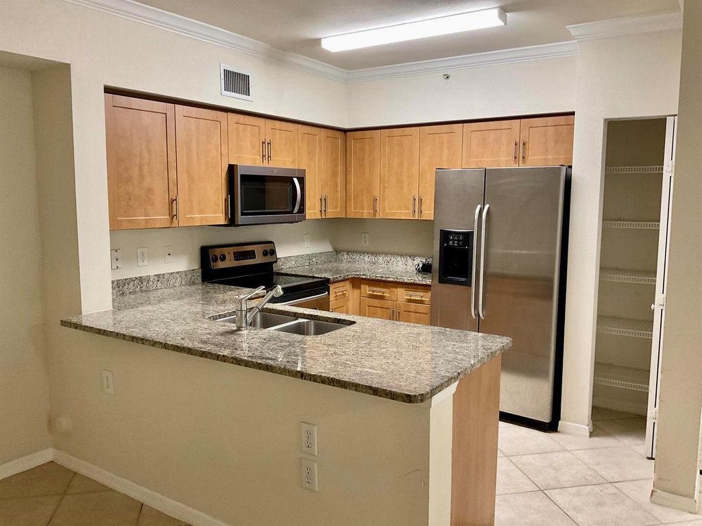 Photo of 6370 Emerald Dunes Drive #103, West Palm Beach, FL 33411 (MLS # R11133883)