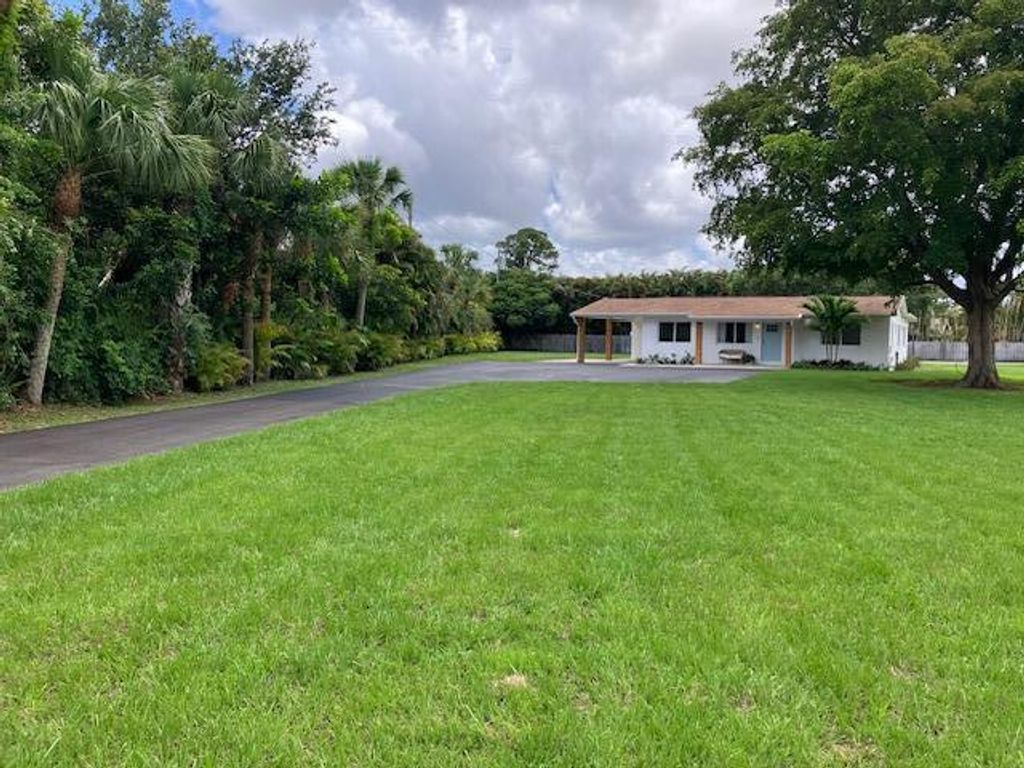 Photo of 8781 N Virginia Avenue, Palm Beach Gardens, FL 33418 (MLS # B26016673)