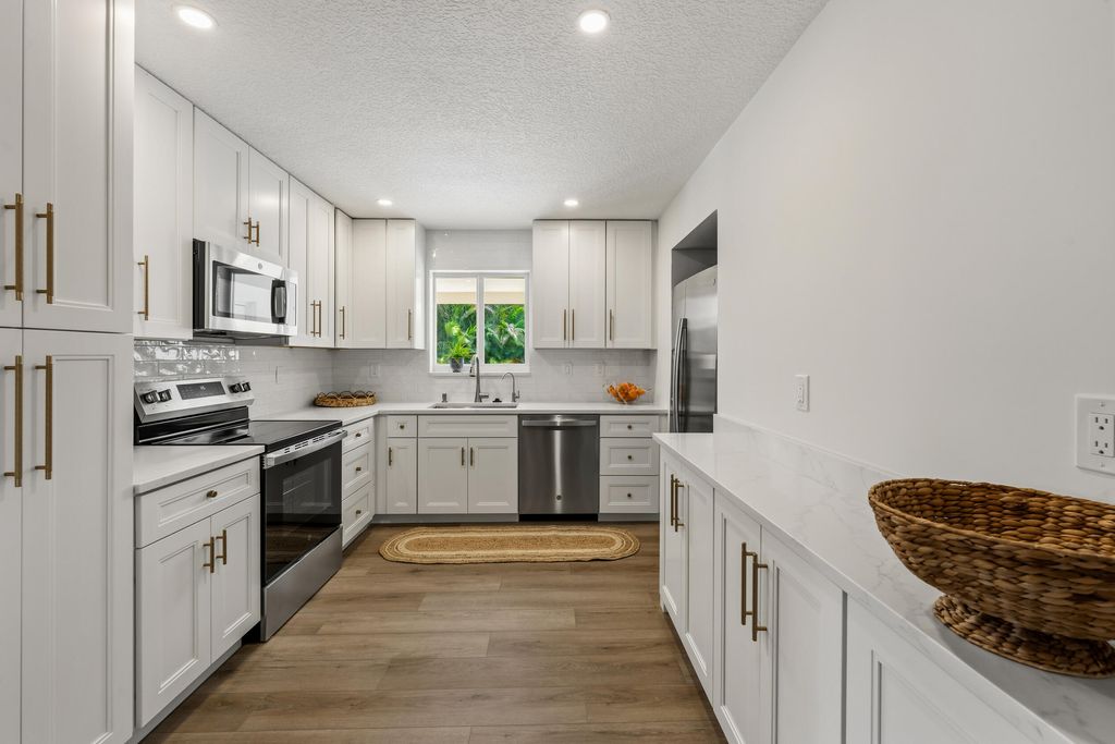 Photo of 8781 N Virginia Avenue, Palm Beach Gardens, FL 33418 (MLS # B26016673)