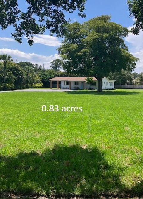 Photo of 8781 N Virginia Avenue, Palm Beach Gardens, FL 33418 (MLS # B26016673)