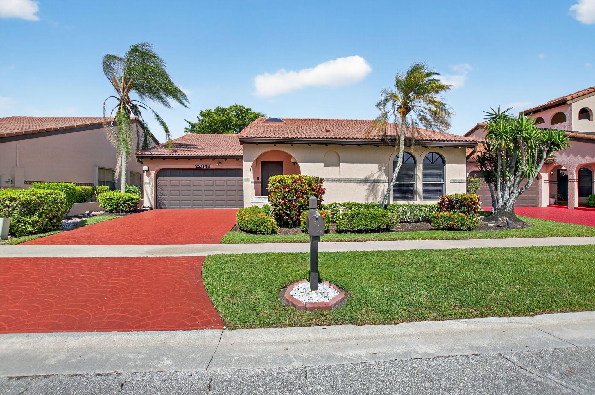 Rarely available in Marbella Woods in Central Boca! This warm & welcoming 3-bedroom, 2-bath single-family home features a split floor plan (primary is separated from the other 2 bedrooms). Enjoy light-filled living spaces with your kitchen overlooking the family room that opens to a dining space and a formal living area. With a vaulted ceiling, the living area feels grand. Relax and entertain on your private, screened-in patio. 2-car garage. Skylight in foyer brings in extra light! Just a short walk to the community pool, and centrally located near shops, dining, and top-rated schools. Non-gated community in the heart of Boca with a true neighborhood feel. Low HOA. Don't miss this gem!