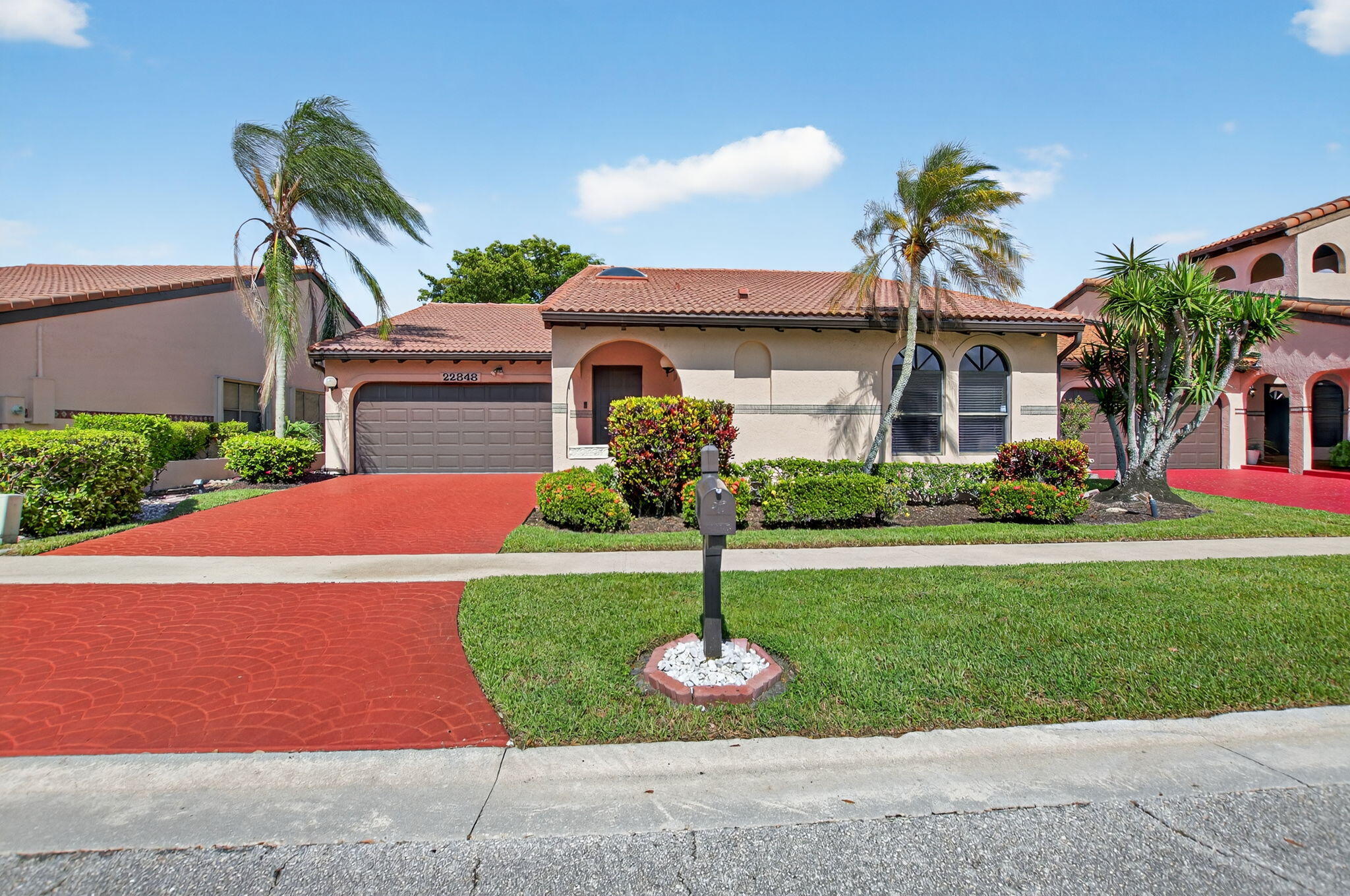 Rarely available in Marbella Woods in Central Boca! This warm & welcoming 3-bedroom, 2-bath single-family home features a split floor plan (primary is separated from the other 2 bedrooms). Enjoy light-filled living spaces with your kitchen overlooking the family room that opens to a dining space and a formal living area. With a vaulted ceiling, the living area feels grand. Relax and entertain on your private, screened-in patio. 2-car garage. Skylight in foyer brings in extra light! Just a short walk to the community pool, and centrally located near shops, dining, and top-rated schools. Non-gated community in the heart of Boca with a true neighborhood feel. Low HOA. Don't miss this gem!