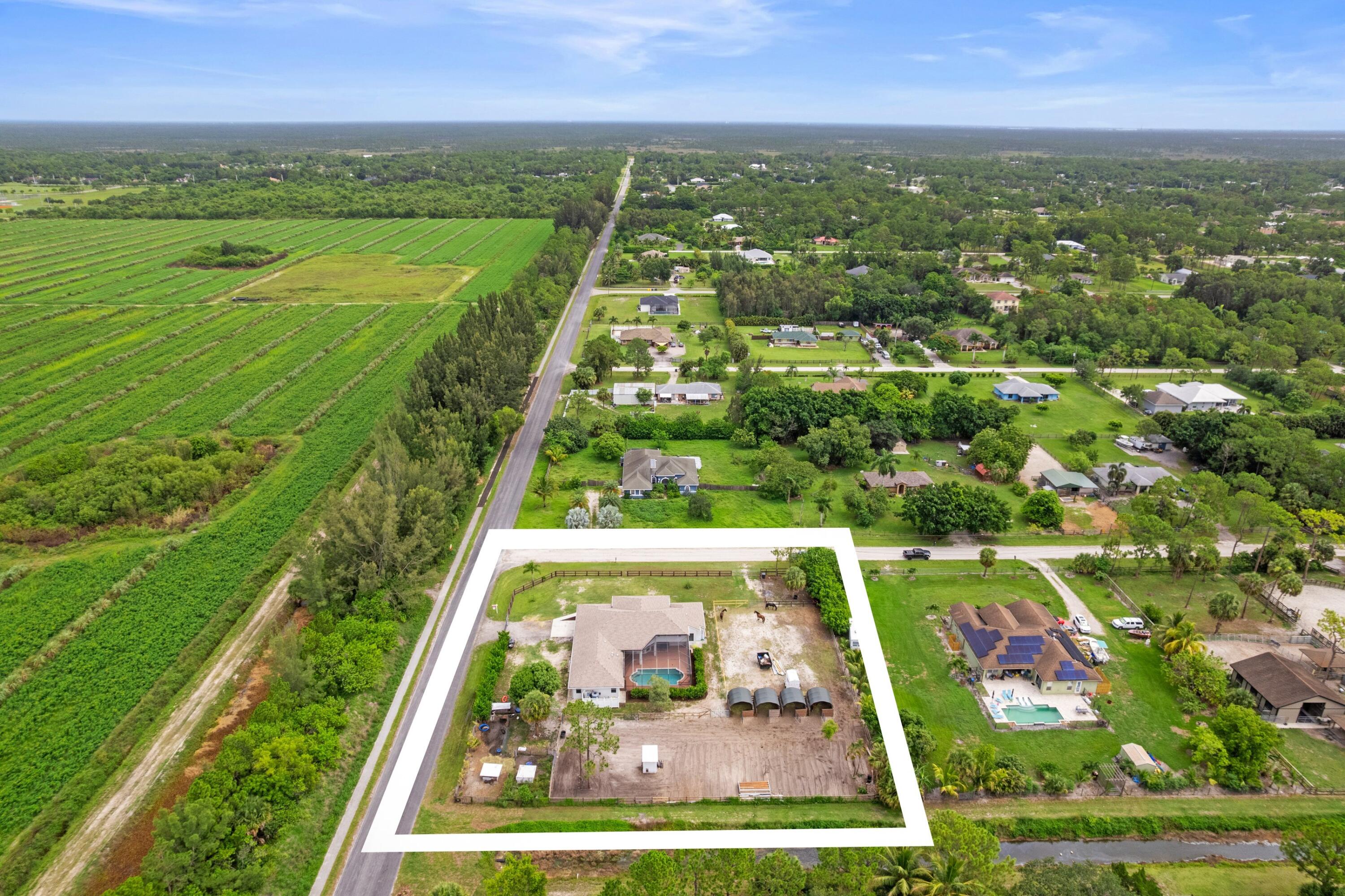 MOTIVATED SELLER!! Exquisite Equestrian Estate in Loxahatchee - Modern Luxury Meets Country Living! Prepare to be captivated by this stunning 5-bedroom, 3-bathroom home with an additional dedicated office or den, perfectly situated on a generous 1.65-acre corner lot in highly desirable Loxahatchee. Built in 2004, this impressive 2,955 sq ft (under air) residence has undergone a complete transformation, with everything updated or replaced since 2022, ensuring a turn-key experience for its new owners. (see more)