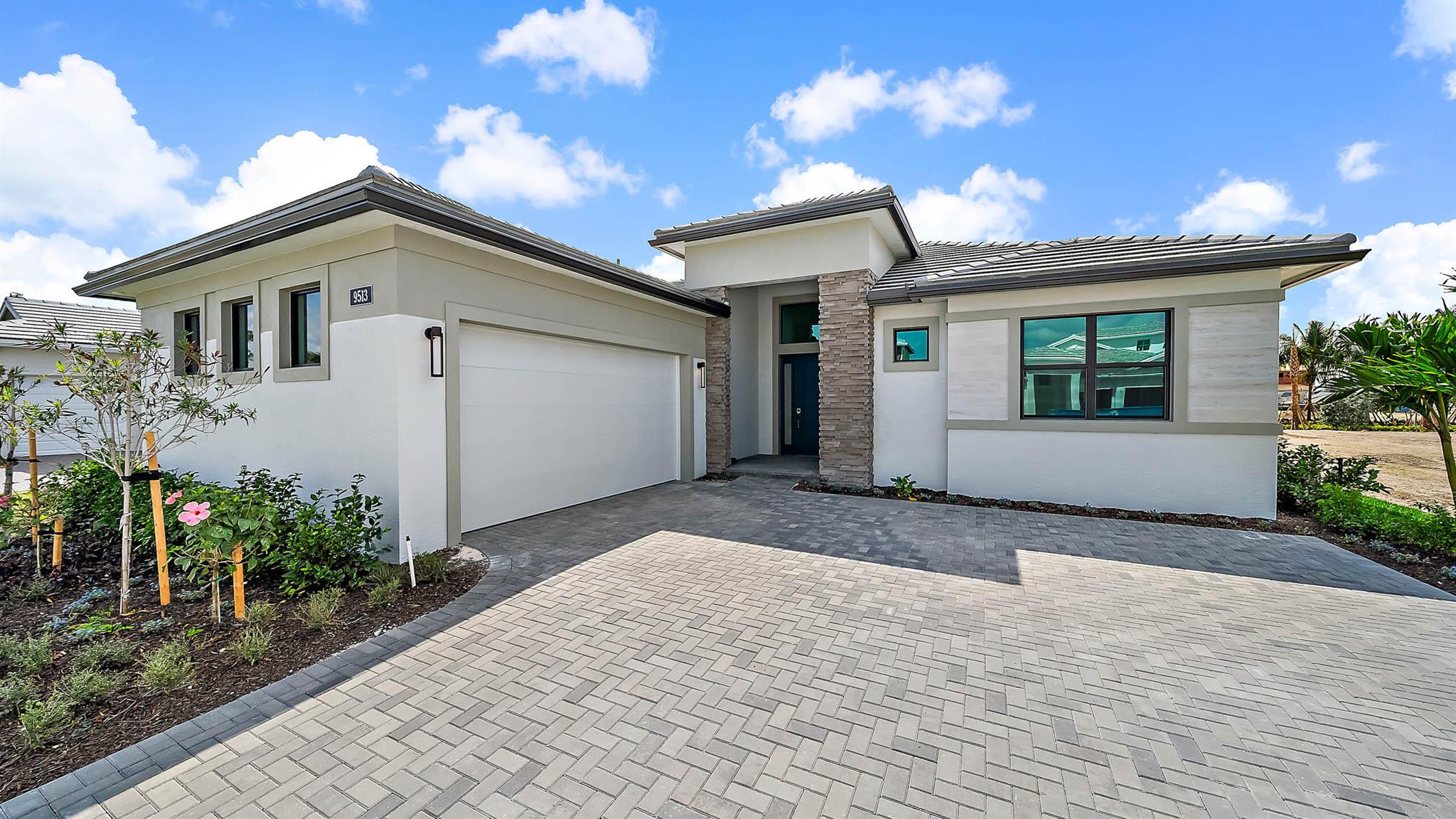***New Construction** Move in ready. Welcome to the newly built Riley floorplan by Kolter Homes, located in the gated community of L'Ambiance at Avenir. This spacious and elegantly designed home features 3 Bedrooms, 3.5 Bathrooms, a Flex Room, Great Room, Dining Room, Covered Lanai, and a 2-Car garage. Ideally positioned near the neighborhood entrance, mail kiosk, and the future Great Egret Clubhouse, this home offers both convenience and luxury.A striking 16' wide by 10' tall sliding glass door opens the Great Room to the lanai, creating a seamless indoor-outdoor living experience.
