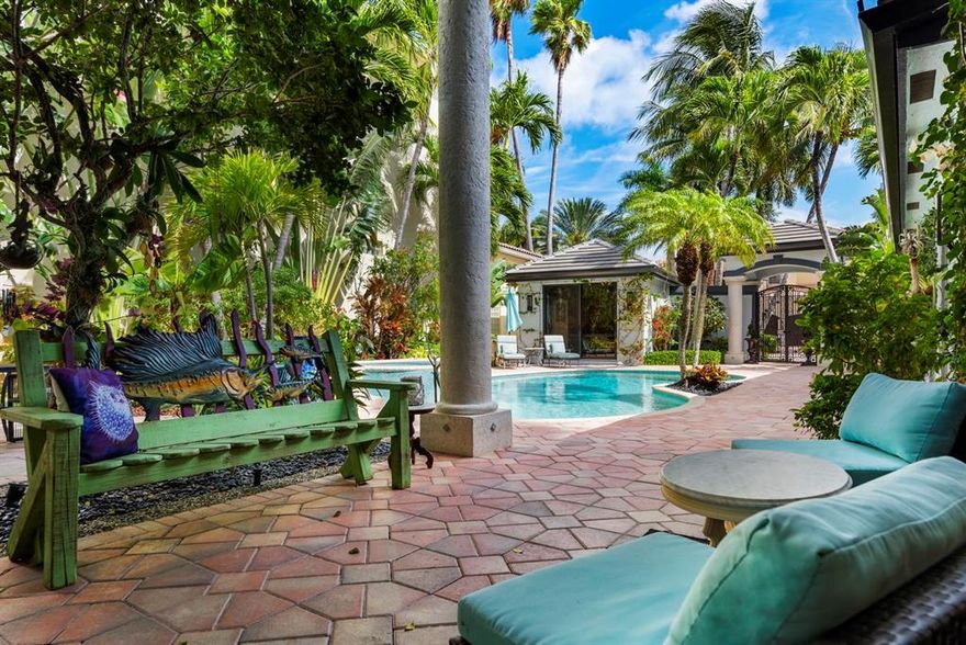 ONE OF A KIND fully remodeled single-story masterpiece located in gated BOCA HIGHLANDS/GRAND CAY ESTATES Beach Club community. This waterfront estate will captivate you from the moment you enter private courtyard encompassing heated pool and  separate guest house. Luxury details, designer chefs kitchen and high-end finishes extend throughout the Estate. Boasting spacious and private resort style living, Exotic wide plank wood flooring, complete impact windows, doors and sliders. Rare opportunity to own such a well laid out and thoughtfully appointed home, professionally designed with a traditional modern Zen, framed with timeless elements. 258 ft in depth, deep-water lot. Includes an over-sized tiki hut overlooking the water. Spacious pet friendly area including covered grill and bar.