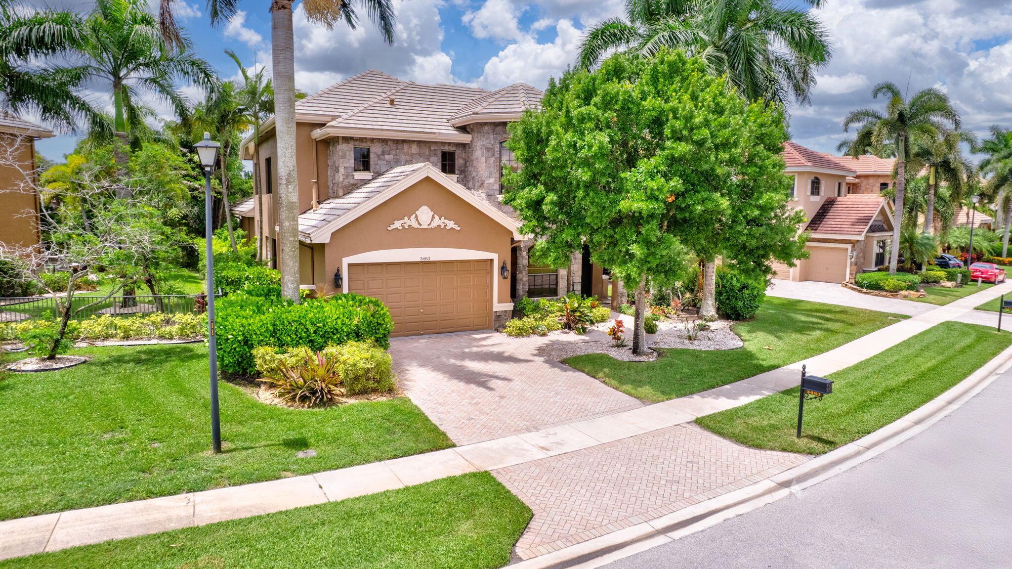 **Lease-to-Own Opportunity | Spacious & Elegant Home in Versailles**This is a rare chance to lease-to-own a beautifully designed home in the exclusive, gated Versailles community. This home is perfect for large families or anyone looking for comfort, space, and style in one of Wellington's most sought-after neighborhoods.Inside, you'll find five generously sized bedrooms, plus a den and a dedicated office, offering plenty of room for both living and working. The layout is thoughtful and functional, with the primary suite privately located on the first floor.