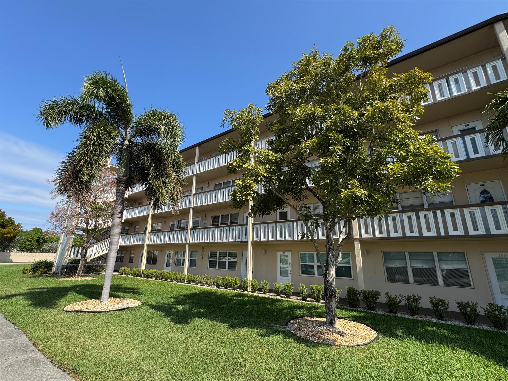 Move right in! This beautifully updated turnkey 1-bedroom, 1.5-bath condo is located in the vibrant 55+ resort-style community of Century Village. Relax and unwind in the spacious Florida room with private garden views. The home features a newer central A/C and is conveniently located near both stairs and an elevator.Inside, enjoy an inviting open kitchen with a stylish backsplash, custom lighting, glass-top range, built-in closets for ample storage, and an extra small refrigerator for added convenience. The building also offers additional storage in the laundry room. The condo is tastefully furnished with quality furniture and features tile flooring throughout for easy maintenance. Accordion shutters provide extra security and peace of mind.