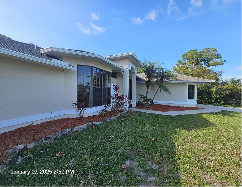 Photo of 2122 SW Burman Lane, Port Saint Lucie, FL 34983 (MLS # R11051673)