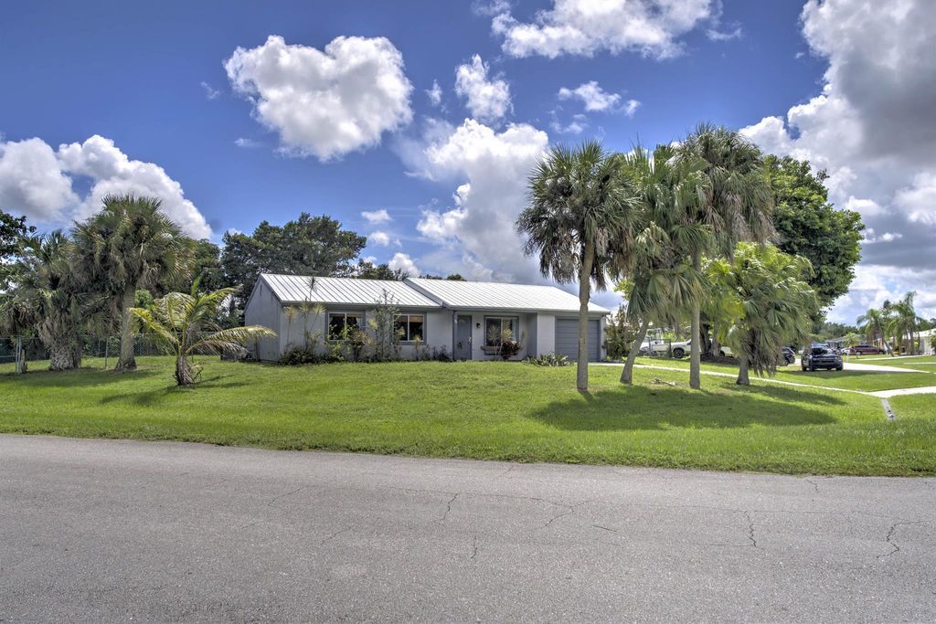 Photo of 337 SW Cherryhill Road, Port Saint Lucie, FL 34953 (MLS # R11125844)