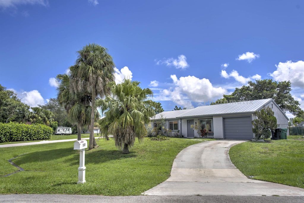 Photo of 337 SW Cherryhill Road, Port Saint Lucie, FL 34953 (MLS # R11125844)