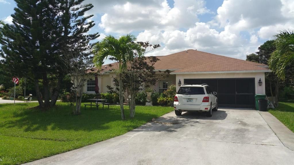 Photo of 473 SW Prater Avenue, Port Saint Lucie, FL 34953 (MLS # R10733406)