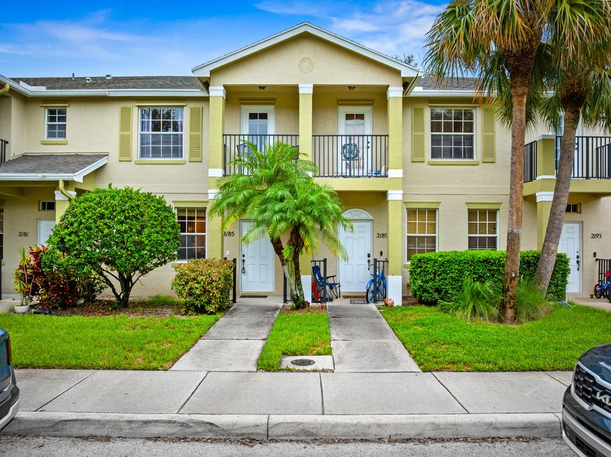 Best value in East Lake Village! This updated 2BR/2.5BA townhome with 1,350 sq. ft.   Features include tile floors on the main level, an eat-in kitchen, private patio, 1-car garage, and upstairs bedrooms with tray ceilings. The primary suite offers a private balcony, and a new roof adds peace of mind. Enjoy sidewalks, community pool, and green spaces, all minutes from shopping, schools, and Treasure Coast beaches. Move-in ready and competitively priced, this is the most affordable turnkey option in the neighborhood!