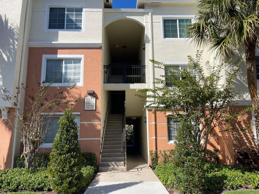 Spacious 3-Bedroom / 2-Bath Condo with Private Garage - First Floor..Rare opportunity to rent a first-floor condo with a highly sought-after private garage in a gated, resort-style community. This bright and spacious unit features a split floor plan, tile flooring throughout (no carpet), and modern finishes. The kitchen is equipped with stainless steel appliances, granite countertops, and in-unit laundry for convenience. Residents enjoy access to outstanding community amenities including a pool, fitness center, clubhouse, playground, BBQ area, car wash station, and more. Water is included in the rent. One small pet permitted. Located in a prime area near Target, Aldi, Walmart, Publix, Regal Cinemas, with easy access to US-441 and the Florida Turnpike. Available immediately.