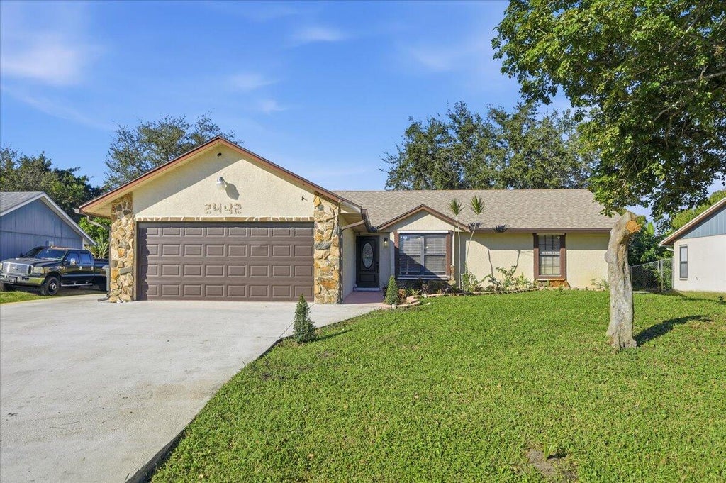 Photo of 2442 SW Lafayette St, Port Saint Lucie, FL 34984 (MLS # R11150538)