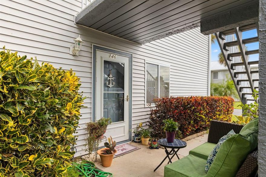 Beautifully remodeled unit with granite countertops and white shaker cabinets.  Both bathrooms have been updated and there is gray laminate flooring throughout.  Cozy screened porch overlooking a green space.  HOA takes care of the exterior maintenance.