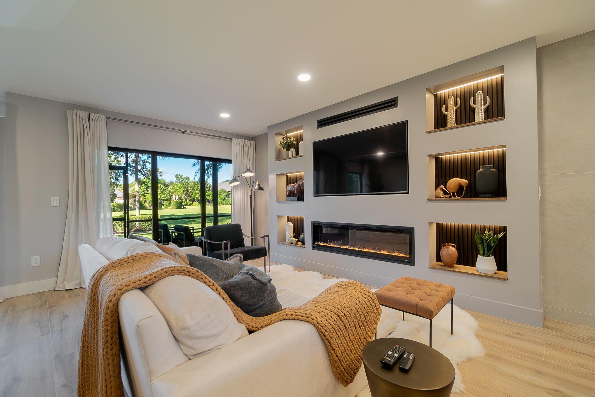 Step into a beautifully totally renovated two-bedroom, two-bathroom one-of-a-kind condo at the Palm Beach Polo and Country Club in Wellington. The open concept plan apartment boasts abundant natural light, and a modern yet elegant vibe. The living area features stylish furniture arranged around a sleek fireplace and opens onto a private balcony with stunning views. The kitchen is a chef's dream with top-notch appliances, custom cabinetry, and marble countertops. Living at the Palm Beach and Polo Club grants its residents access to exclusive amenities like state of the art gym, tennis courts, and a clubhouse with fine dining. It's the perfect blend of upscale living and leisure in one of Wellington's premier communities. Call today for a private showing!