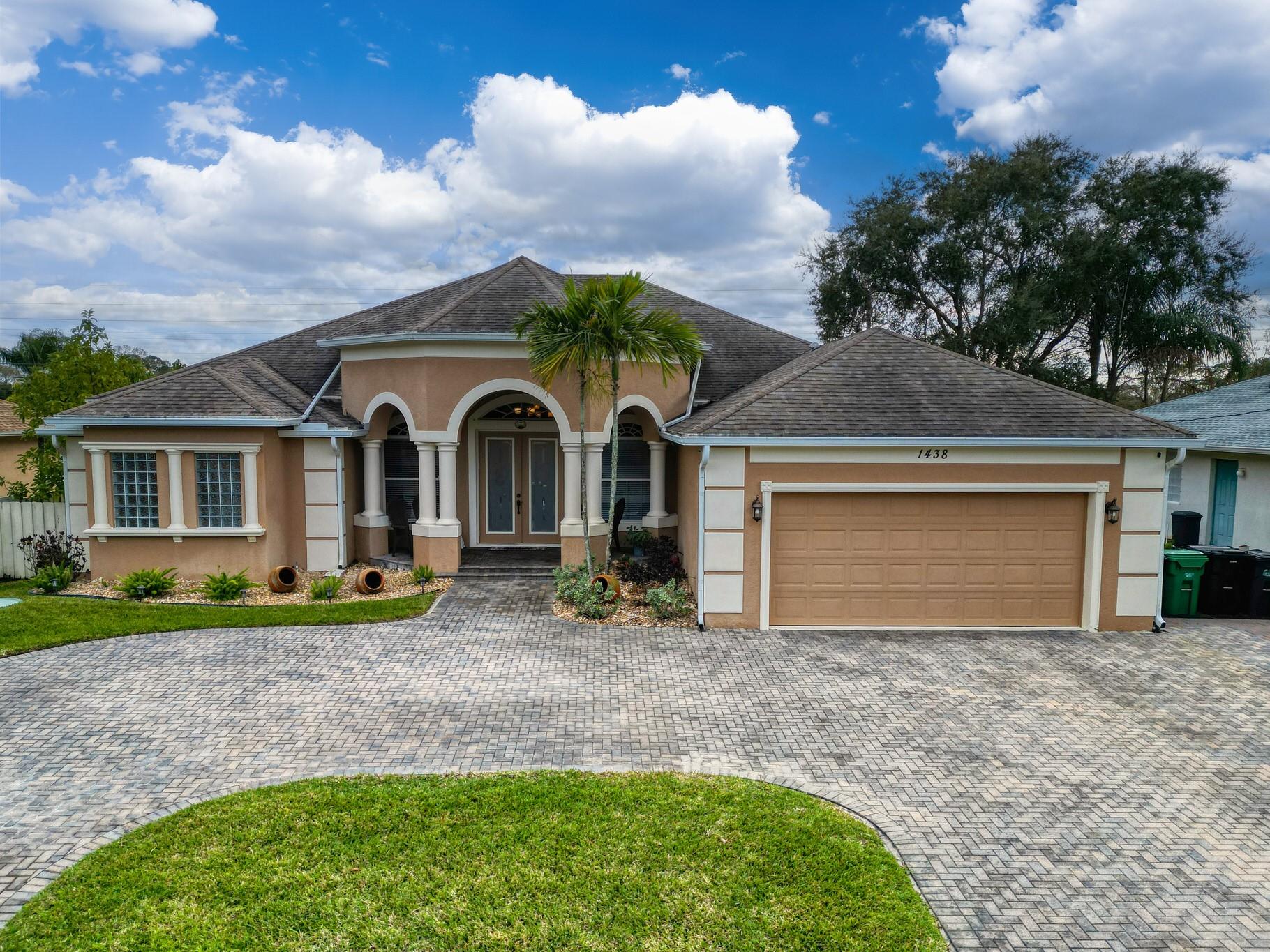 Amazing home in Port St. Lucie. Impressive 4 bed w/ additional office, den/bonus room, and 4 baths. Gorgeous home is truly move-in ready. Garage; extended paved driveway w/ room for boat. Entrance boasts double glass doors, raised foyer, and high adorned ceilings. Gourmet kitchen with oak cabinetry, great center island; stainless steel; granite countertops; eat-in, breakfast nook and formal dining. Laundry room with additional storage offers convenience. Expansive living room plenty of natural sunlight; French doors to large enclosed patio w/cabana bath perfect for entertaining or relaxation around pool, spa & slide. Magnificent master bed w/crown molding and pool access. 2 new AC units optimal comfort. Centrally located to all! $10,000 closing credit for buyer with full price offer.