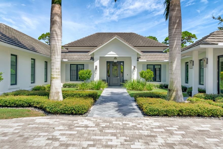 Located in the prestigious community Loblolly Pines, lies this beautifully crafted estate home built in 2019. Designed by architect Scott Baruch & Associates and sited on one of the premiere lots, this custom built residence has endless        features and does not disappoint. Attention to detail was paramount in constructing this four bedroom, four and two half bath home with a bright open floorplan, pristine mill work, vaulted and coffered ceilings, hurricane rated impact         windows and doors throughout. Inside you will find continuous wood-look tile floors, an open kitchen with custom cabinetry and leathered quartzite countertops, an appliance garage, stainless steel and paneled Thermador appliances and a generous bar area with Sub-Zero wine refrigerator with drawers, dishwasher a and icemaker. Oversized stacked sliders welcome you to the spectacular open lanai and summer kitchen, where you can enjoy majestical views of the pool and spa and let the outdoors in.
The primary suite encompasses over 600 Sq. Ft. with seating area, walk-in his and her closet, bathroom featuring an oversized frameless glass shower that is joined by a beautifully tiled outdoor shower, floating contemporary cabinetry and quartz top double vanity. The ample guest suite is accessible through it's own private entrance and is warm and inviting. All bedrooms are beautifully appointed and enjoy built-in closets and ensuite baths.