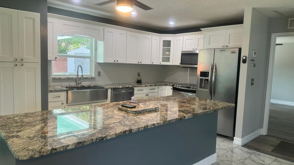 Photo of 926 SE Belfast Avenue, Port Saint Lucie, FL 34983 (MLS # R10990850)