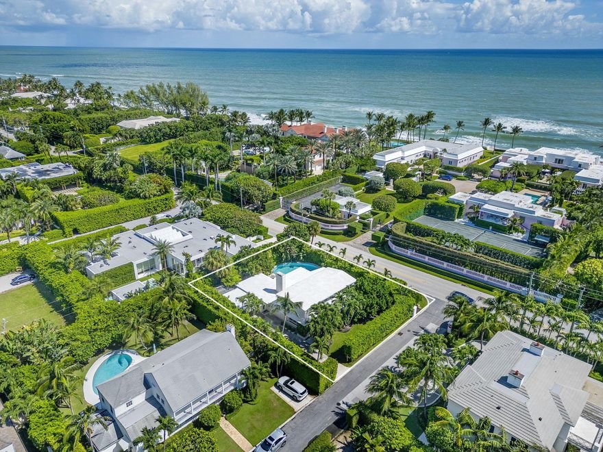 Welcome to 205 Jamaica Lane. This stunning mid-century modern home is situated on a lushly landscaped, 11,000+ sq ft lot on the North End. This architectural gem offers a private retreat with sleek lines, abundant natural lighting, and a a spacious living area with volume ceilings and a sunroom overlooking the pool. Enjoy the North End lifestyle with easy access to the Lake Trail and the widest beaches on the island.