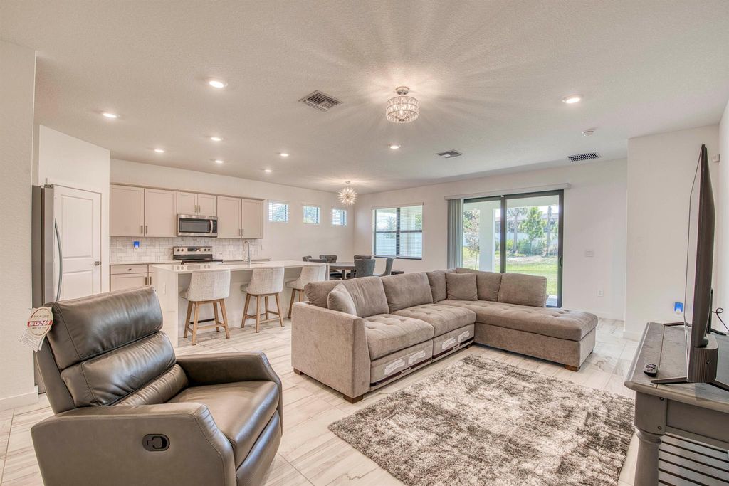 Photo of 1850 NE Ocean Dunes Drive, Jensen Beach, FL 34957 (MLS # R11100779)