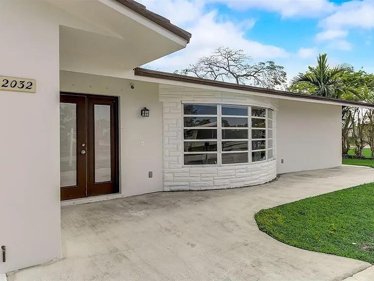 Largest model in the neighborhood! Spacious 6 bed/3 bath with open split floor plan, featuring two primary suites, plus a garage conversion and bonus bedroom. Brand-new kitchen with solid wood cabinets & appliances. Rare 100% poured concrete construction, including roof & ceilings—built like a bunker and qualifies for special insurance! Upgrades include hurricane-rated garage door, mostly new windows, shutters on all openings, new electrical & full security system. Large corner lot, fully fenced, on a navigable canal for hours of fun. 2-car garage, move-in ready. Close to shopping, schools & highways. A rare find combining safety, space & convenience!