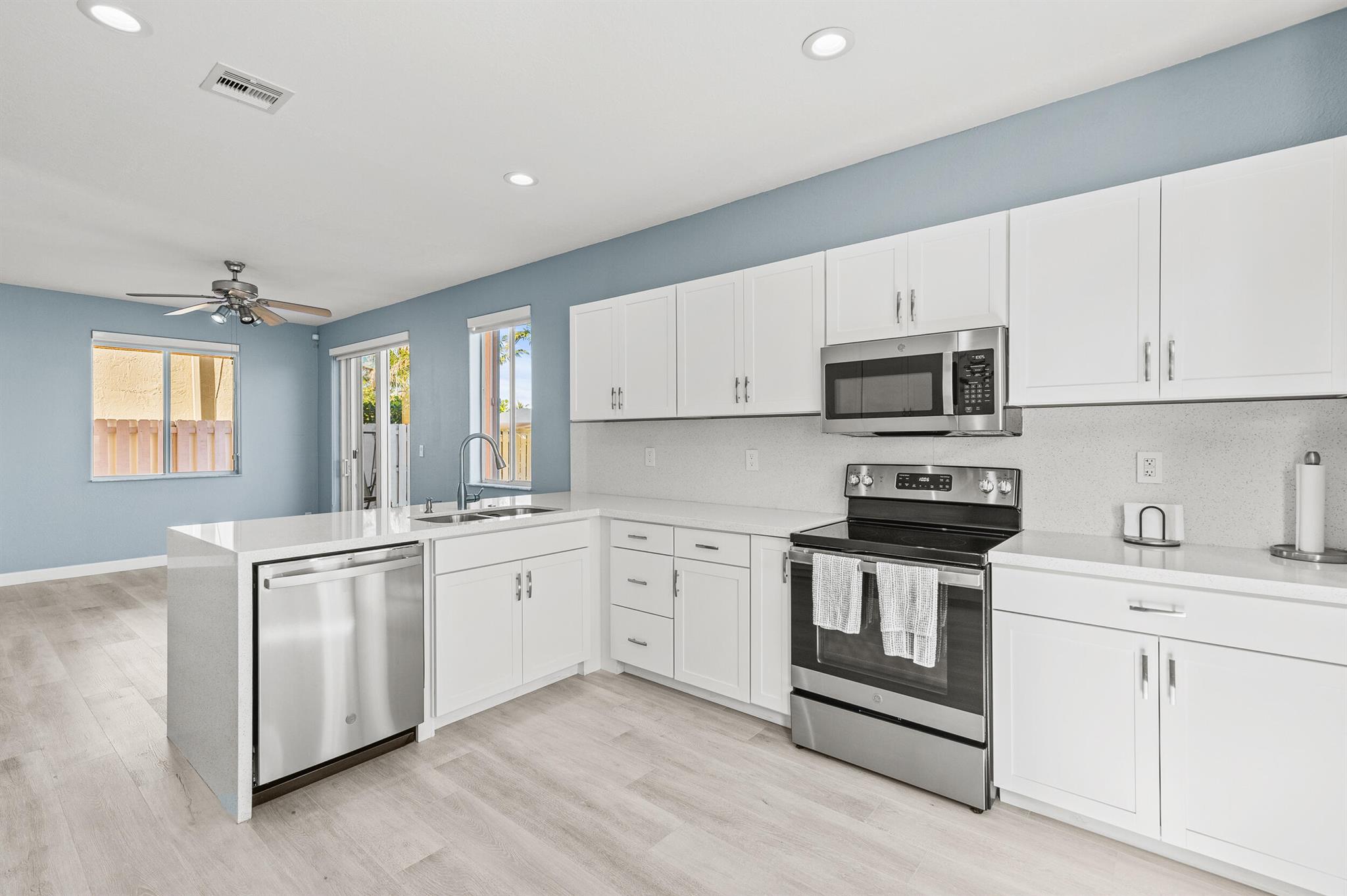 Best Deal in Viscaya with LOW HOA! Beautifully upgraded 4BD/3BA waterfront home in Miramar's sought-after Viscaya community. Enjoy serene lake views with fountain, luxury vinyl flooring, renovated kitchen with quartz countertops & stainless steel appliances. One bed & full bath on the main level. New washer, dryer & water heater. Spacious layout, open-concept living, large backyard, 2-car garage & hurricane shutters. Gated community with 24-hr security, near top schools, dining & highways. Move-in ready!