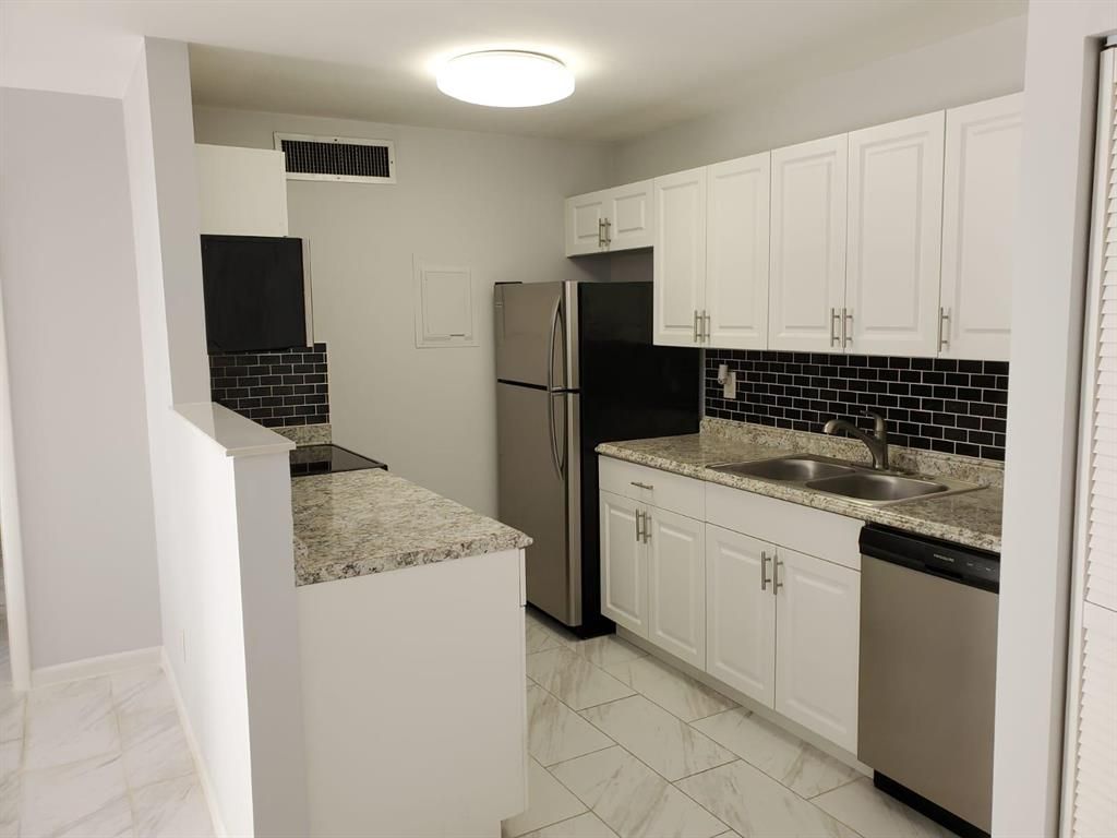 Photo of 637 Executive Center Drive Dr #N102, West Palm Beach, FL 33401 (MLS # R10823131)