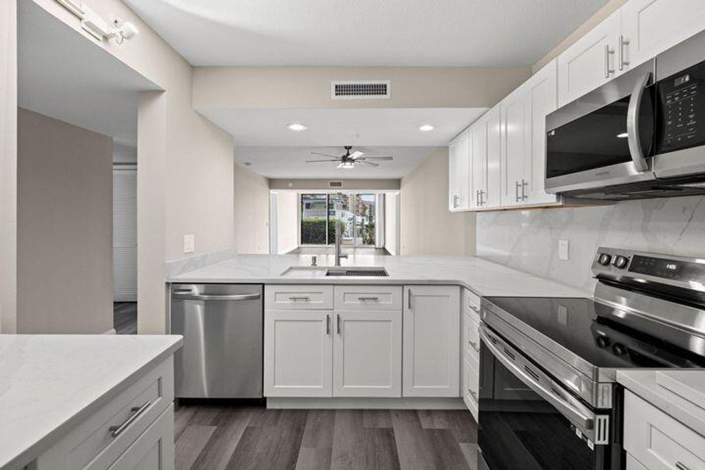 Photo of 2601 Marina Isle Way #103, Jupiter, FL 33477 (MLS # R10947666)