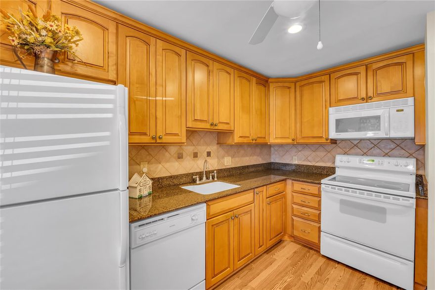 Vistas of Boca Lago is one of Boca's most desirable 55+ communities with so much to offer - This spacious unit is a Ground Floor, Corner apartment- 2 bedroom-2 bath- split floor plan with Stunning Golf views. Newer A/C & Brand-new hot water heater. Newer Laminate flooring. Kitchen has been remodeled with tile backsplash- granite counters & wood cabinets. Primary bathroom shower is beautifully redone, lots of closet space. Stackable washer & dryer. Optional membership to join the country club. This community does offer golf, tennis, dining & many social activities. Parking spot is right outside your door. This unit can be sold furnished or unfurnished. Maintenance includes basic cable, internet pest control, water/sewer & exterior insurance. Call to preview! This one won't last!