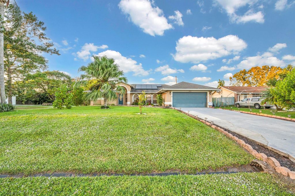 Photo of 2051 SW Akorot Road, Port Saint Lucie, FL 34953 (MLS # R10941598)