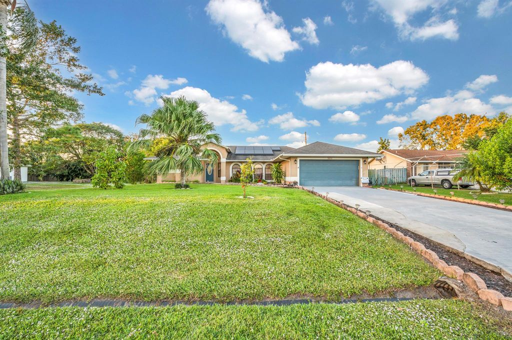Photo of 2051 SW Akorot Road, Port Saint Lucie, FL 34953 (MLS # R10941598)