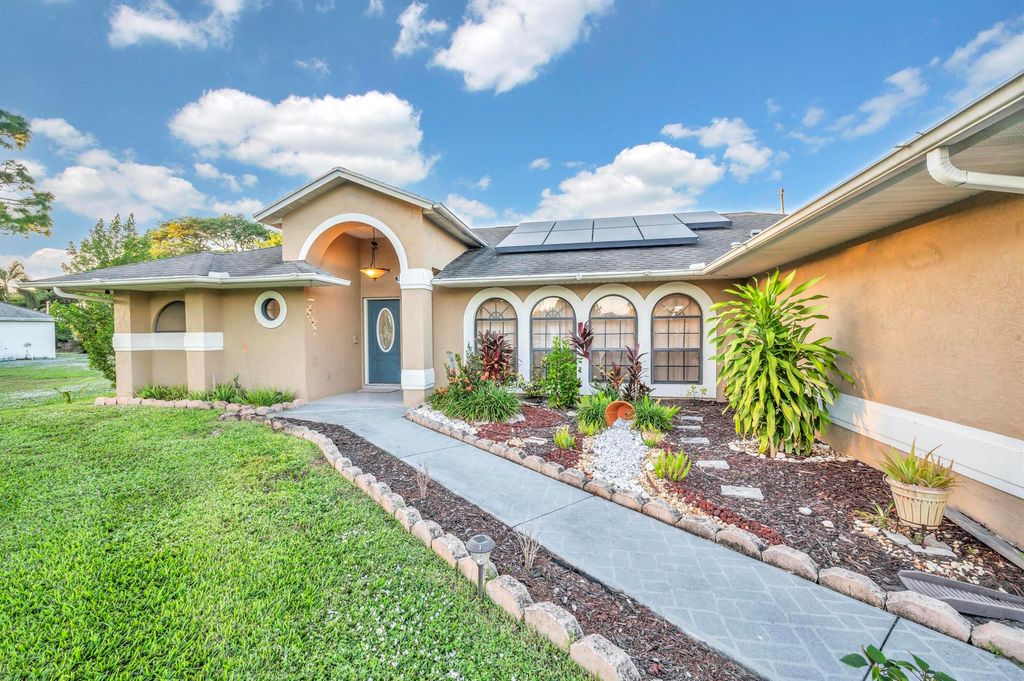 Photo of 2051 SW Akorot Road, Port Saint Lucie, FL 34953 (MLS # R10941598)