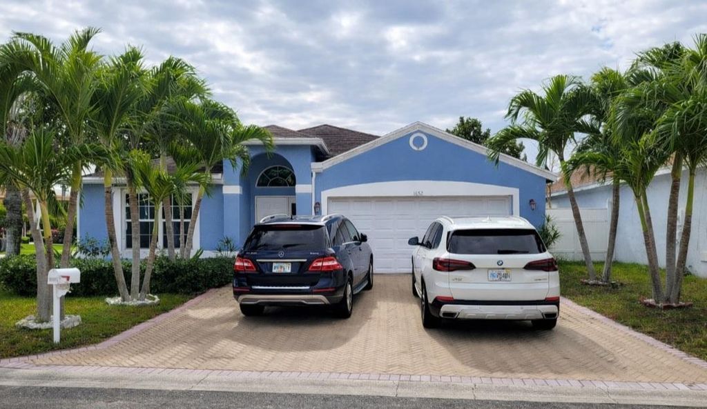 Photo of 1652 Crooked Stick Way, Greenacres, FL 33413 (MLS # R11096725)