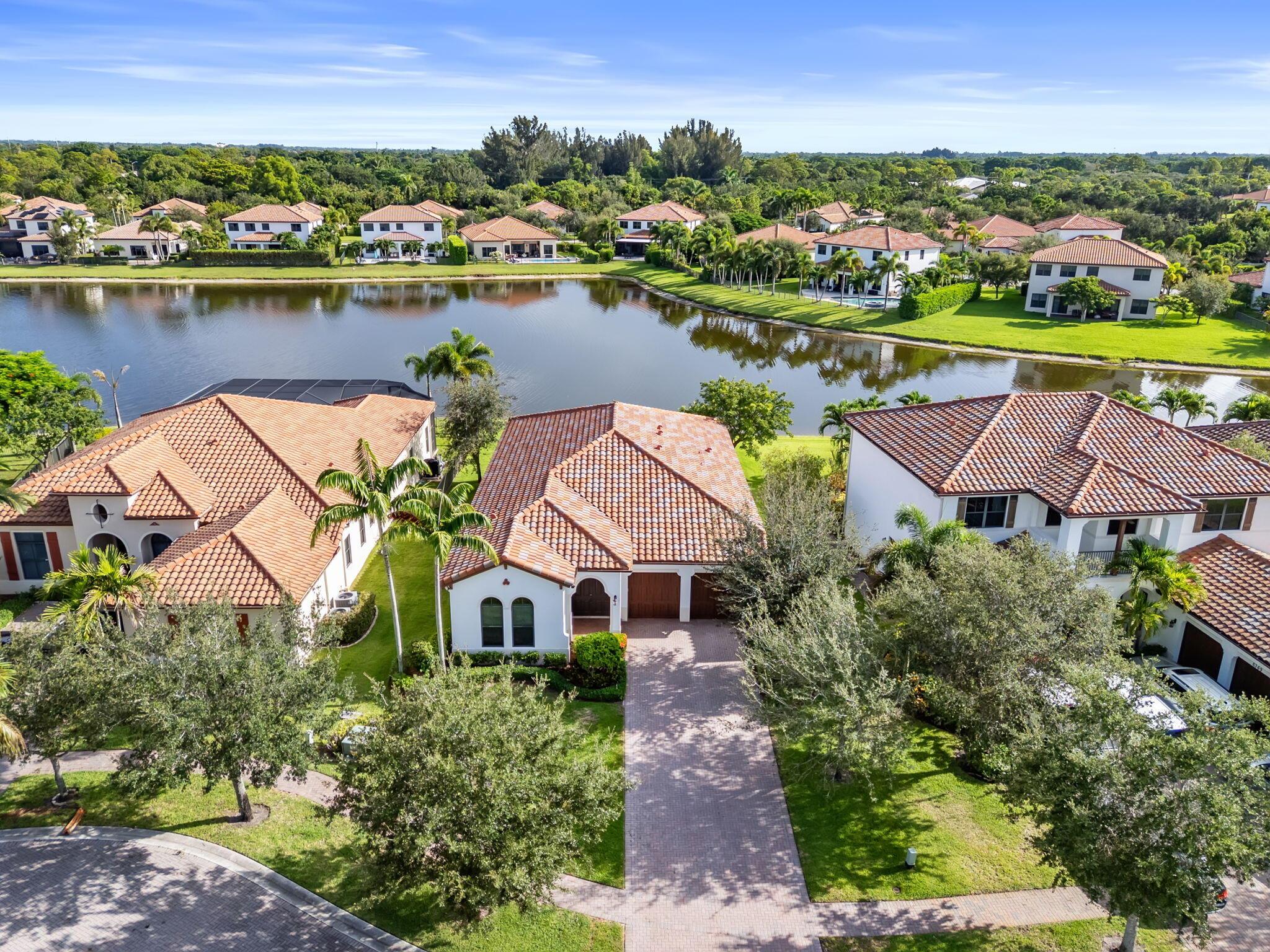 Lakeside living meets everyday luxury in this stunning 4-bedroom, 3-bath home, perfectly situated in the highly sought-after Osprey Oaks community. This newer single-story residence boasts a thoughtfully designed split floor plan, blending functionality with timeless charm.Step inside to find both formal living and dining rooms, soaring ceilings, and generously sized bedrooms. The spacious family room flows effortlessly into the chef inspired kitchen with granite countertops, stainless steel appliances, and a large center island--ideal for entertaining. From here, sliding doors lead to a covered patio with tranquil water views, creating the ultimate indoor/outdoor living space experience! Once back inside, your private primary suite is a true retreat, featuring a tray ceiling,