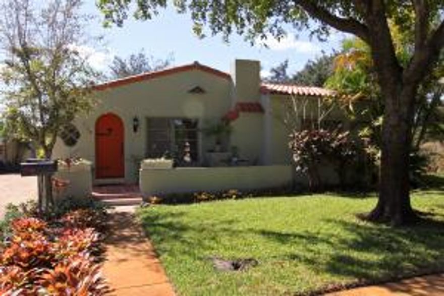 Charming Flamingo Park Mediterranean style residence designed by noted local architect Hansell Hall. Consisting of a main house with 2 bedrooms, 1 bath and a 1 bedroom 1 bath mother-in-law suite which could easily be converted back so the main house is a  large 3/2. Plus a detached garage and a large 1br/1bth apartment. All on a triple lot with space to spare, this sweet home offers the best of all worlds. The main residence has timeless 1920's charm and is built out of hollow tile! Hardwood floors compliment the original architectural details of this home with arched cypress doors, fireplace, formal living and dining rooms, charming kitchen with tiled counters and pine cabinets. Plenty of room for a pool and gardens. Plus a 2 car garage & a Palm Beach stone driveway