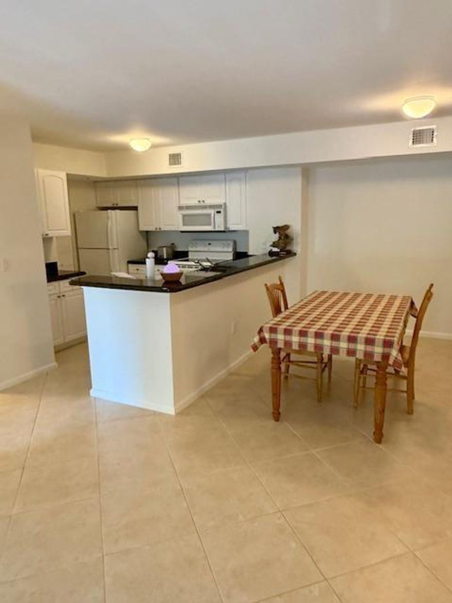 MOTIVATED SELLER. Unit is in move-in condition with split floor plan & two convenient parking spaces (200 & 234). Upgraded features include NEW - A/C, Hot Water Heater, Washer/Dryer, Fans, Window Treatments, Carpet, Paneled Doors, Custom Paint. Bathrooms have NEW shower, tile in tub, toilets, mirrors & flooring. There is an ADT Security System & full Accordion Shutters. Lighthouse Cove is a well-maintained community with recent upgrades including new roofs, painted exteriors & repaved parking lot. Resort-style amenities include: heated pool, fitness center, indoor racquetball, tennis, pickleball, billiards, grills & clubhouse. You can rent immediately upon ownership. Bring an Offer -