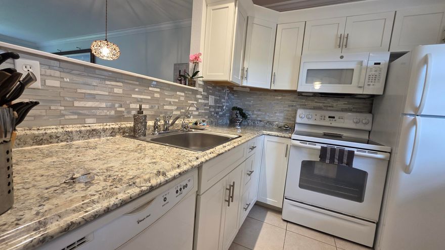 Welcome to this beautifully maintained and fully furnished 1-bedroom, 1-bath condo in the heart of Lauderdale Lakes. This move-in-ready residence features elegant tile floors throughout, impact windows for added peace of mind, and breathtaking views of the sparkling pool and beautifully landscaped tropical grounds.  Extremely clean and lovingly cared for, this unit showcases true pride of ownership. Enjoy relaxing from your living area while overlooking the lush greenery and resort-style surroundings that make this community so desirable. The building and grounds are exceptionally well maintained, offering a peaceful and welcoming atmosphere year-round.  Being sold fully furnished, this condo is perfect for seasonal living, a winter retreat, or full-time residency.
