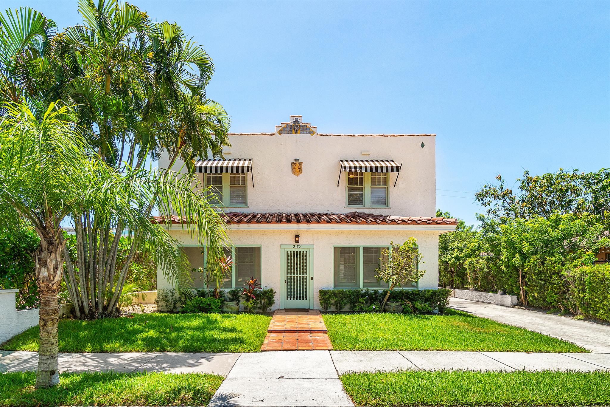 This 1925 Mediterranean residence blends historic charm with modern comfort in one of West Palm Beach's most desirable neighborhoods. The main home offers 4 bedrooms, 3.5 baths, an enclosed veranda entryway with pecky cypress ceilings and porcelain floor welcomes you into a spacious 1,200 sqft grand, open plan living area with fireplace and dining room for entertaining, hardwood floors, and a fireplace that reflect its timeless character.Designed for outdoor living, the spacious cabana opens directly to the pool and patio, creating a true private retreat. Showcasing a sparkling resort-style pool, and lush tropical landscaping--this property is perfect for entertaining or relaxing in complete privacy.