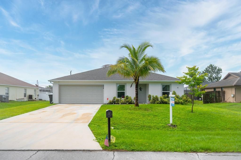 Photo of 572 SW Buswell Avenue, Port St Lucie, FL 34983 (MLS # R10923353)