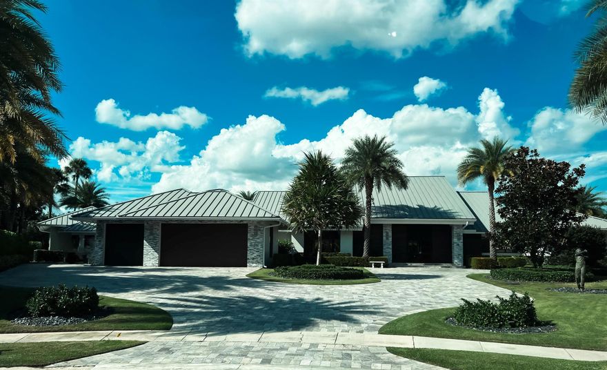 Nestled at the end of a serene cul-de-sac on a massive panoramic golf course lot, this stunning contemporary residence in the prestigious Delaire Country Club is an entertainer's dream and a true architectural marvel. From the moment you step inside, you're greeted by luxurious, light-filled spaces with walls of windows that showcase breathtaking views of the meticulously maintained golf course and resort-style pool. Boasting 4 generously proportioned bedrooms, including two lavish primary suites, this home offers exceptional privacy and comfort. The open-concept floor plan flows effortlessly, with sleek porcelain tile flooring throughout. The state-of-the-art kitchen is a culinary delight, featuring an abundance of cabinetry, a massive walk-in pantry, a coffee bar, and a large